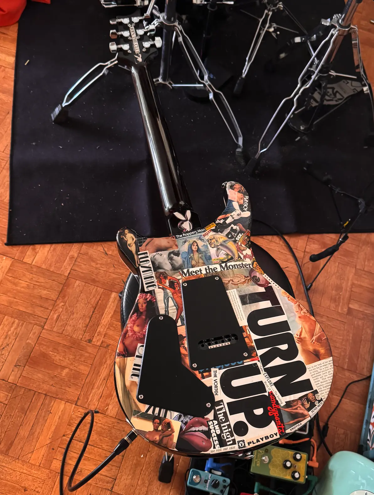 Back of commissioned guitar covered with layered vintage collage artwork